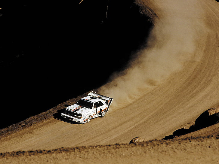 audi car driving on a gravel