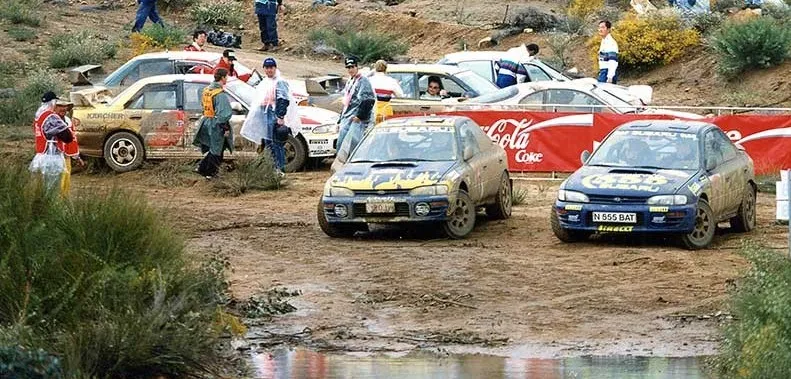 two subarus on side of the road