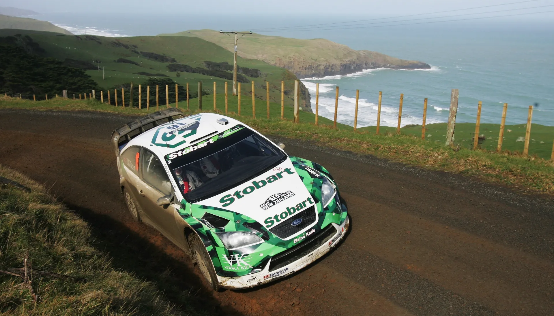 green ford with a landscape view of the coast