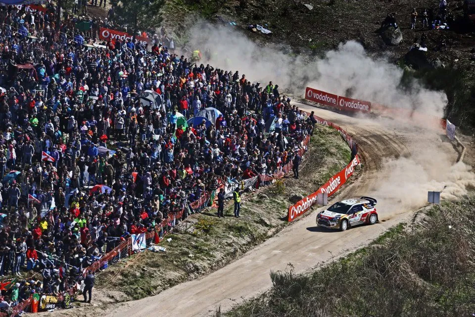 car drifting on a gravel leaving a dust trail