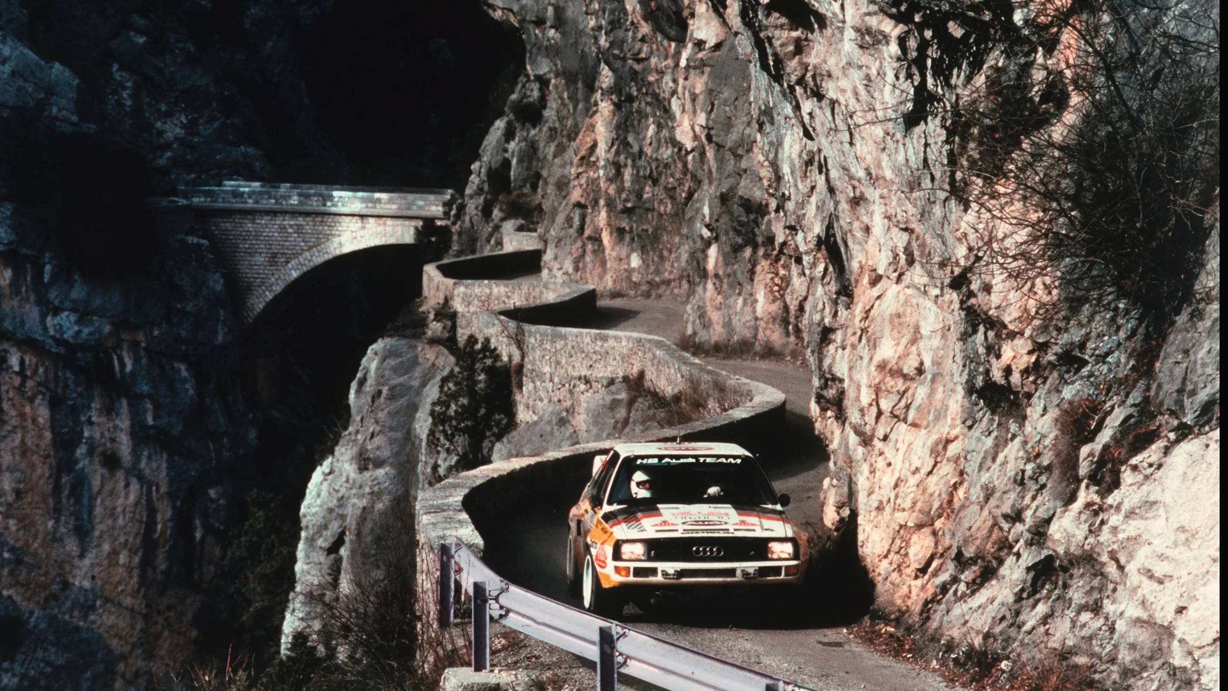 audi quattro on a curly mountain road