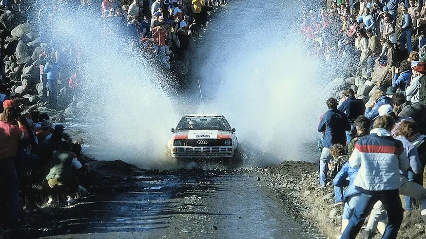 audi quattro passing through water splash