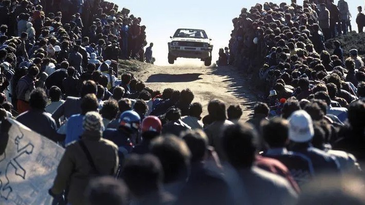 audi quattro jumping through a crowd